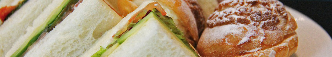 Eating Deli Sandwich at Three Pickles Subs & Sandwiches restaurant in Goleta, CA.